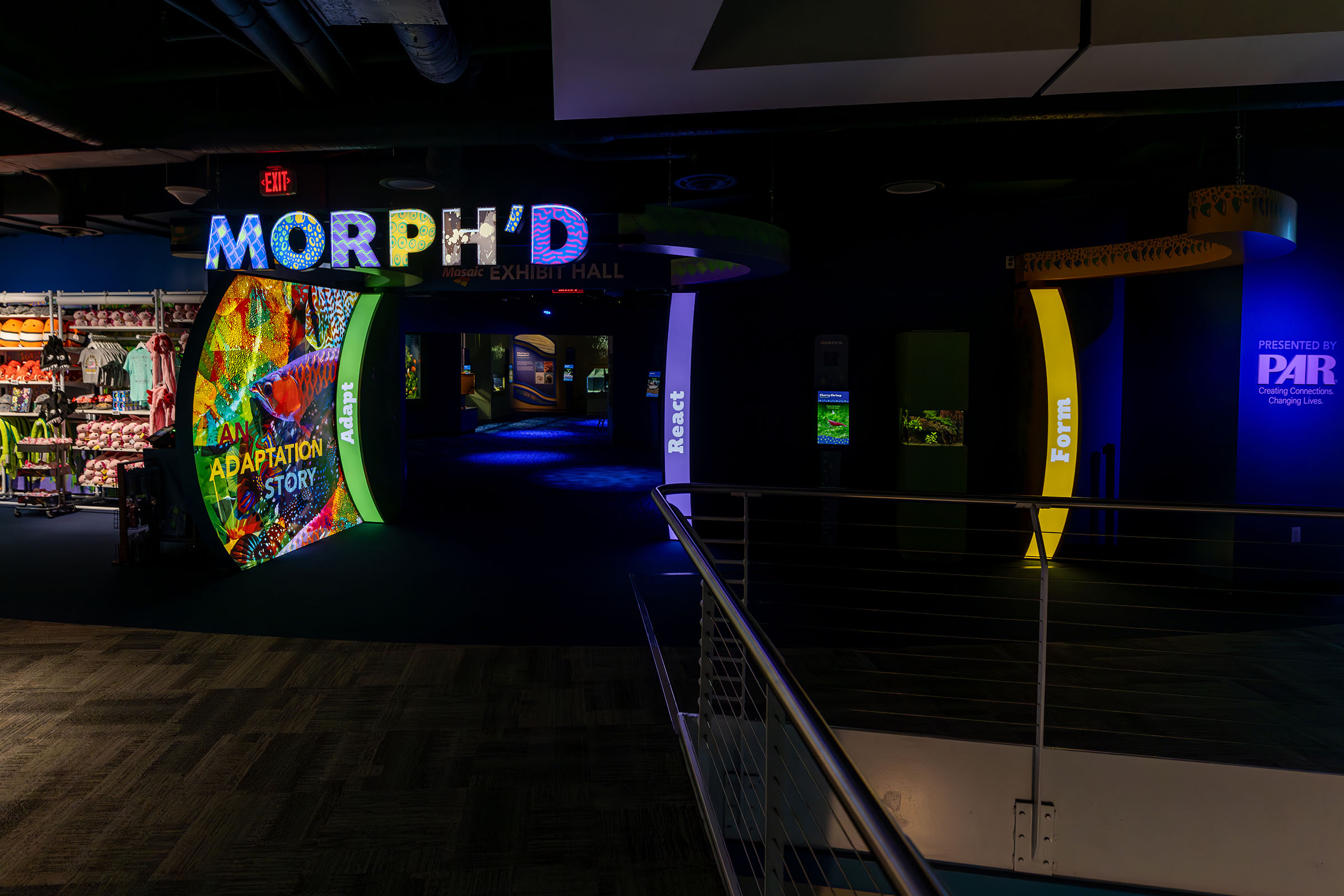 Entrance to Mosaic Exhibit Hall featuring the MORPH'D gallery presented by PAR® with gift shop on left