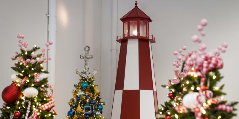 YuleTides at The Florida Aquarium decor preview lighthouse and trees