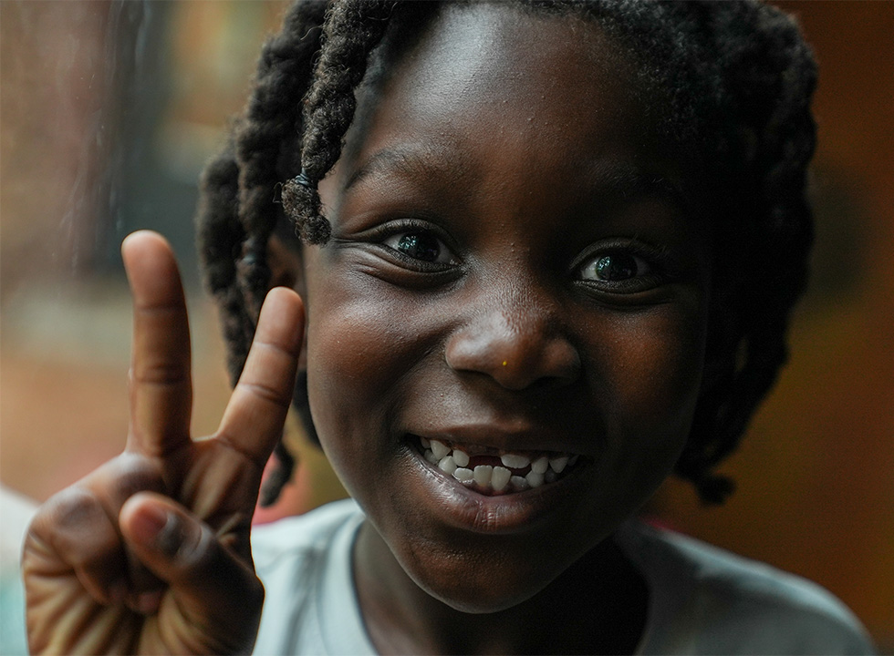 little boy making a peace sign at The Florida Aquarium