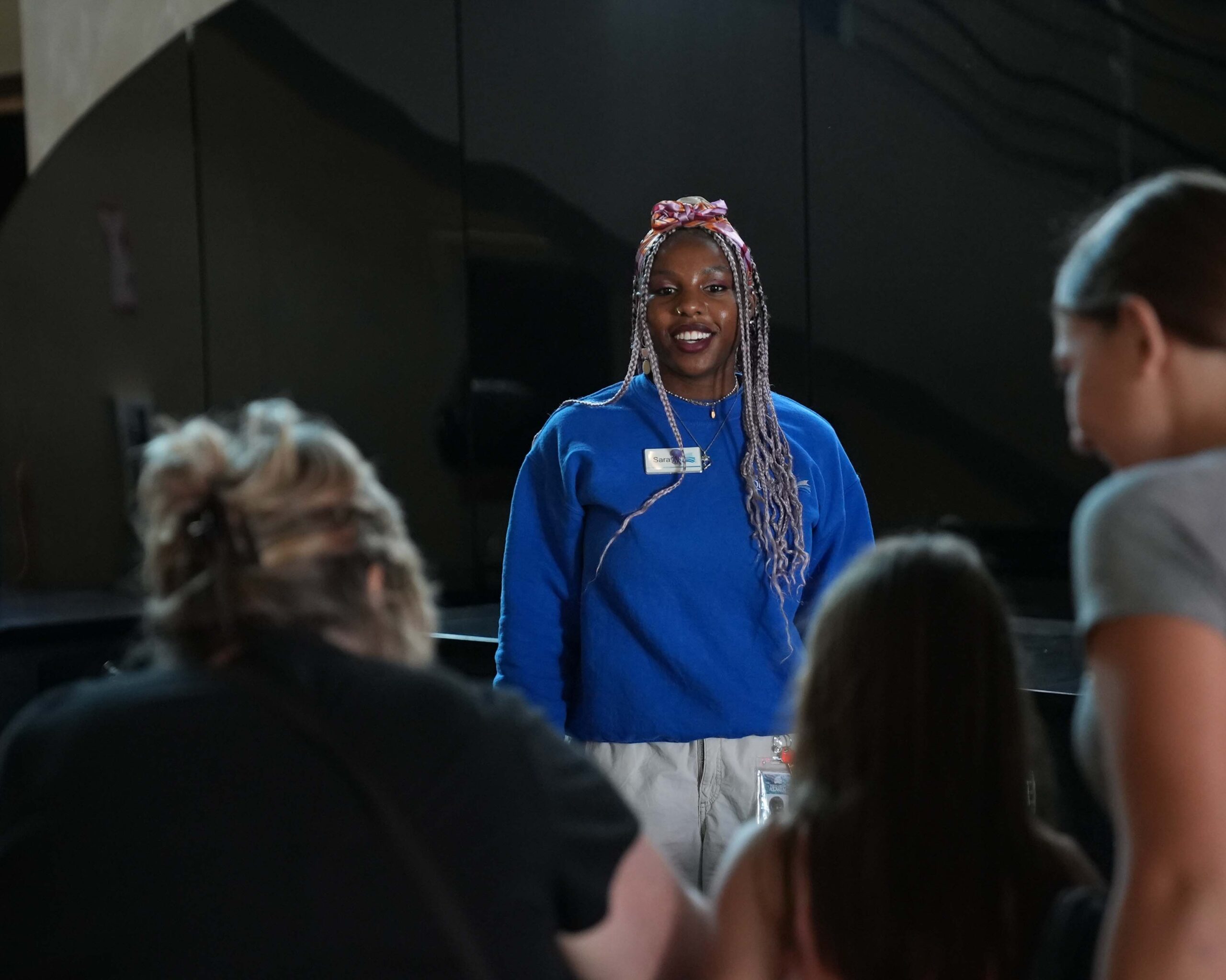 Female Intern speaking to guests at the Florida Aquarium