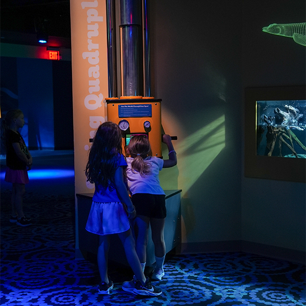 two young girls in MORPH'D gallery with four eyed fish interactive